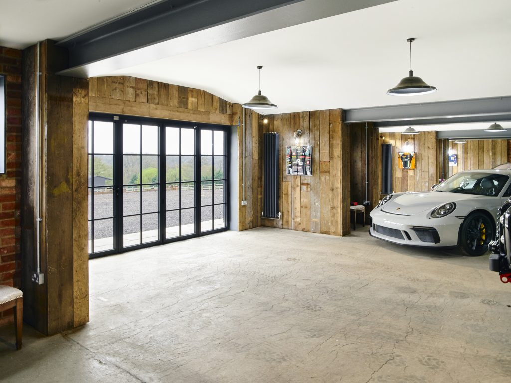 The Griffin project - luxury garage - luxury cars - grey wood interior