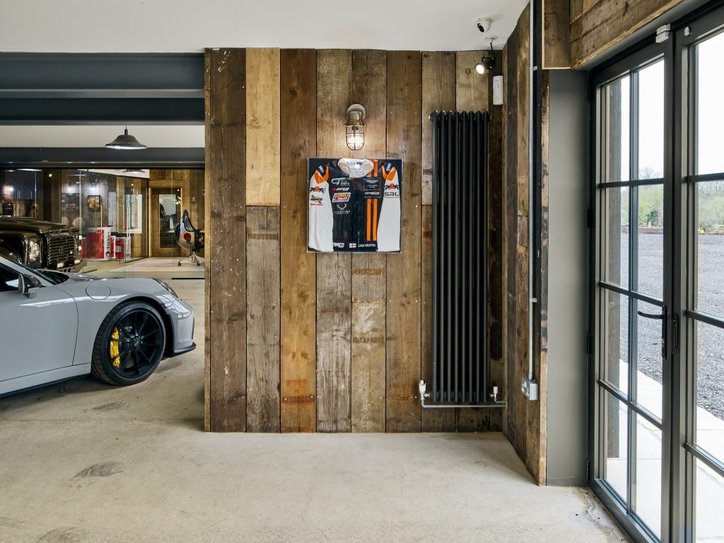 The Griffin project - luxury garage - luxury cars - grey wood interior