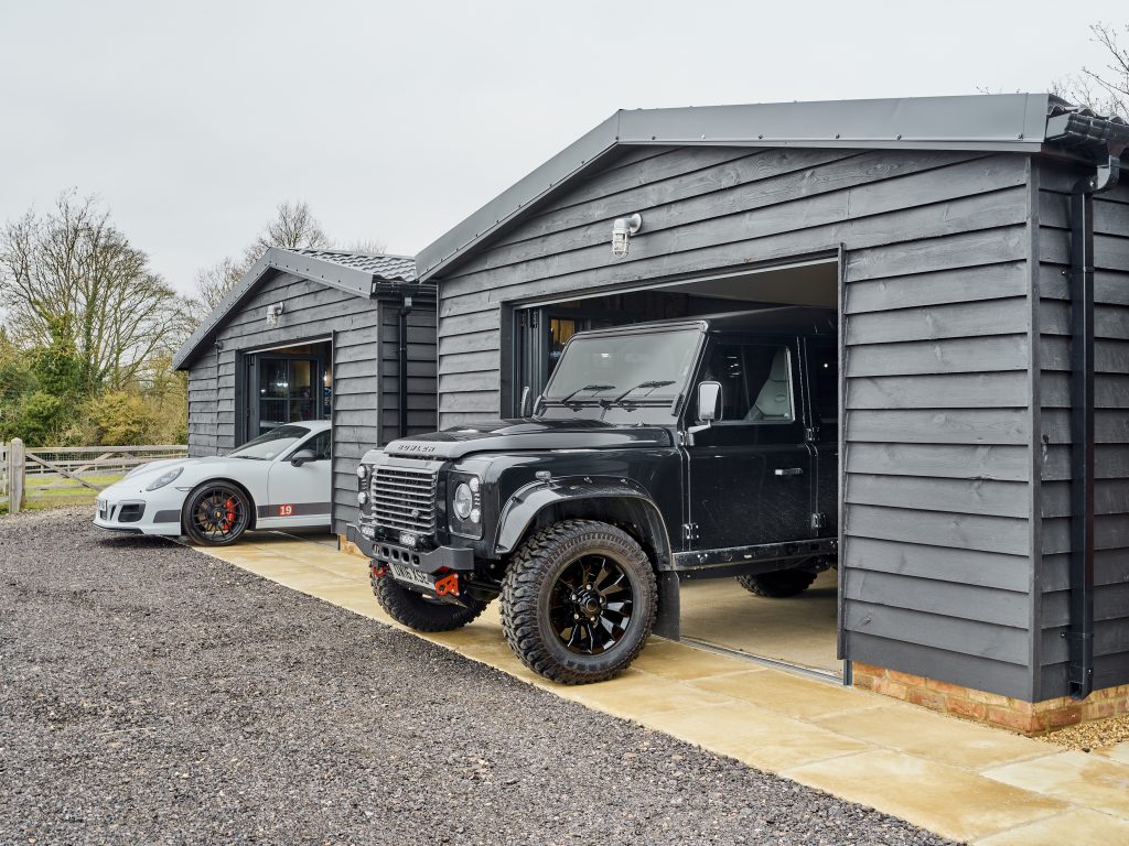 The Griffin project - luxury garage - luxury cars - grey wood exterior