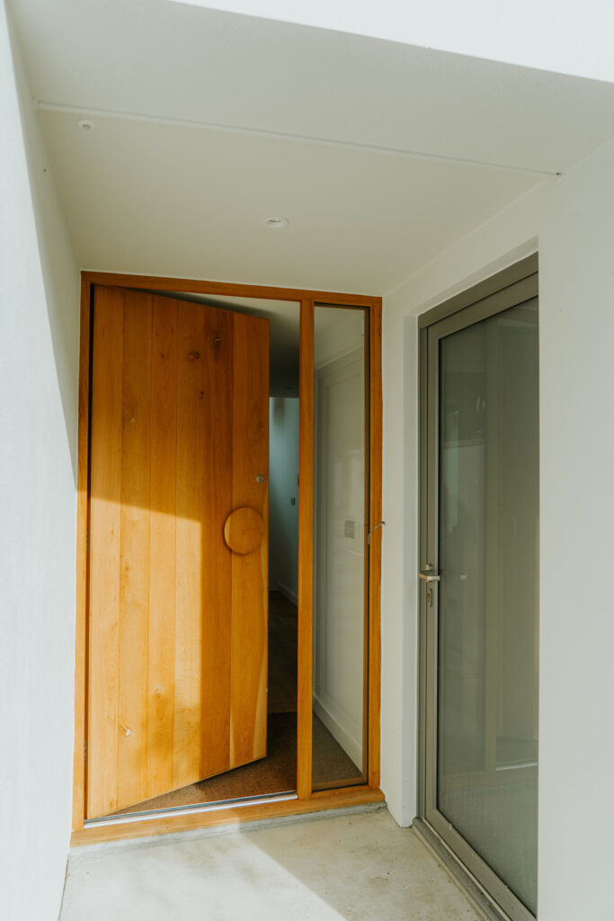 Armada property the Oaks project - modern contemporary new build open front door